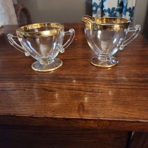 Vintage creamer and sugar. Clear with gold trim.  Depression glass